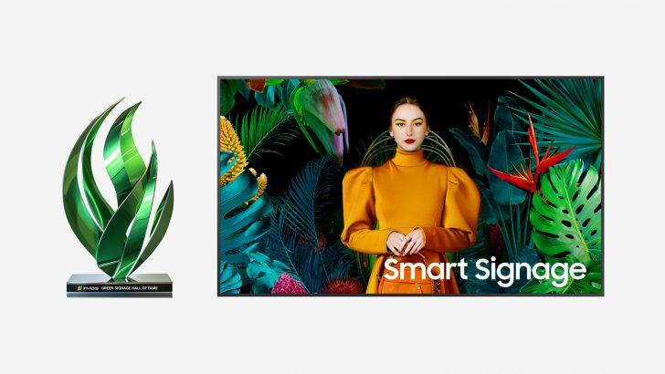 Samsung Smart Signage display showing branded retail content alongside the Green Signage certification award.
